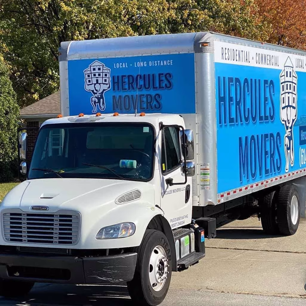 columbus in state moving oh Hercules Movers truck parked on residential street.